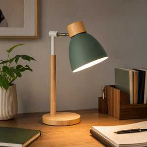 Luminária de mesa verde sálvia acesa em home office