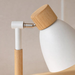 Detalhe do braço metálico e articulação da luminária branca