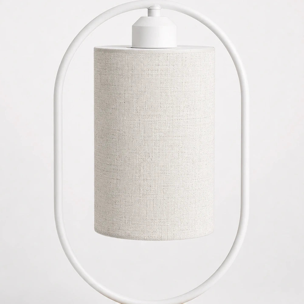 Luminária de mesa oval branca apagada em fundo neutro