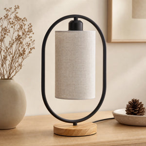 Luminária de mesa oval preta apagada completa em cenário neutro