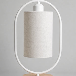 Variante branca da luminária de mesa oval com base de madeira