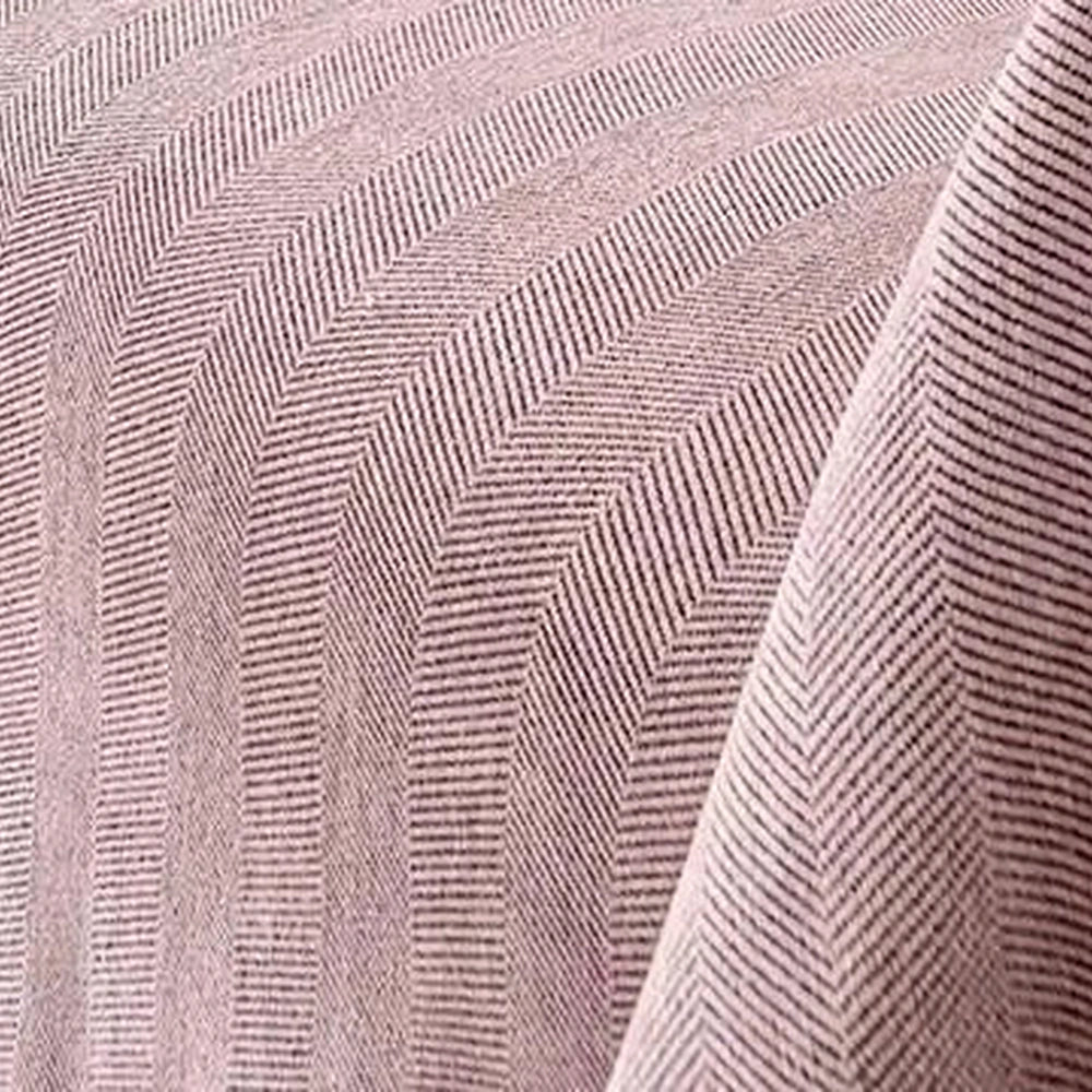 Detalhe da textura real da capa de sofá rosa