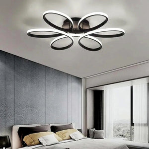 Lustre LED floral preto de 58 cm em contexto de uso real na sala