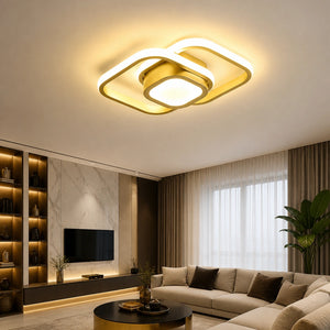 Lustre LED de teto moderno dourado quadrado aceso em sala contemporânea