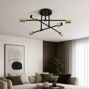 Lustre moderno preto e dourado instalado em sala de estar