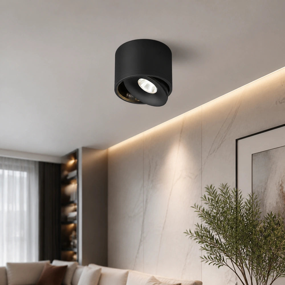 Spot de teto LED de sobrepor preto instalado em sala contemporânea
